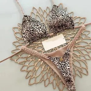 Women’s sexy leopard-print bikini set — striped beachwear for summer; two-piece thong bikini with a casual halter-neck swim top featuring a crisscross design; triangle bikini.