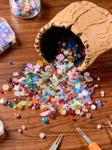 A box of 100g mixed color crystal glass beads, used for jewelry production, with surface inlaid with sunshine patterns, various scattered beads shining brightly, suitable for bracelet, necklace, pendant and jewelry production