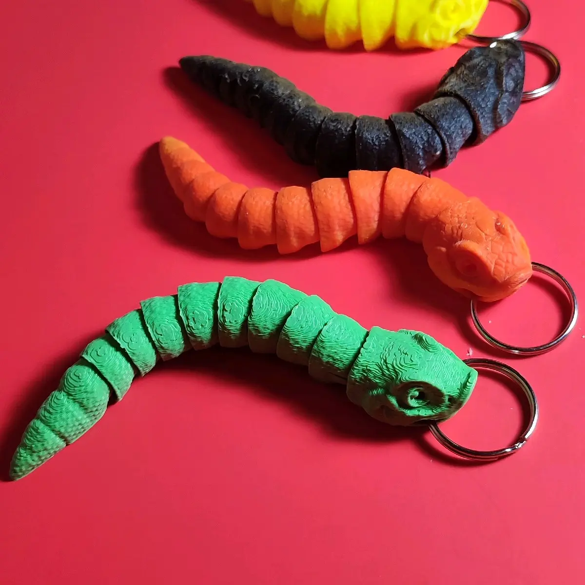 articulated hognose snake keychain, available in four color choices