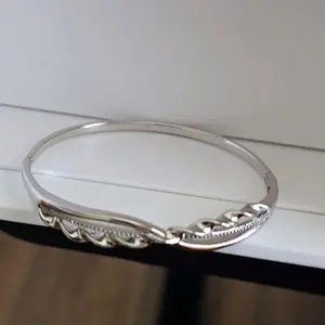Silver Bangle with Intricate Design and Elegant Finish
