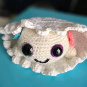 Adorable Crochet Jellyfish Plushie with Big Purple Eyes and Colorful Accents Soft and Cute Design