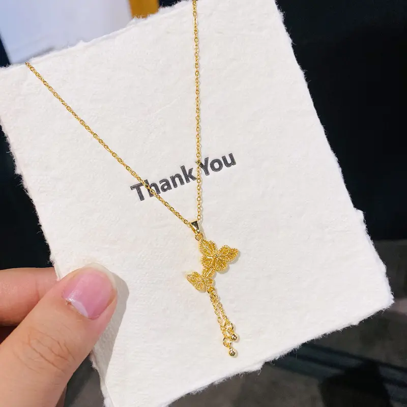 D23 Gold Tassel Hollow Butterfly