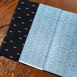 Pink quilted journal perfect for note taking and creative writing.