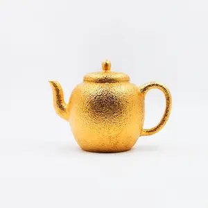 Golden Teapot with Textured Finish and Elegant Design for Tea Lovers
