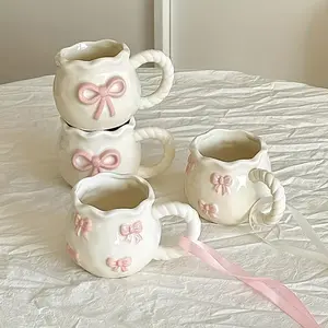 Ceramic coffee cup with pink bow design, Coffee drinkware - table setting, birthday, wedding or Valentine's Day gift - kitchen decoration and special occasion gift, exclusive for coffee lovers, reusable drinking utensils, wavy edge cup, floral pattern