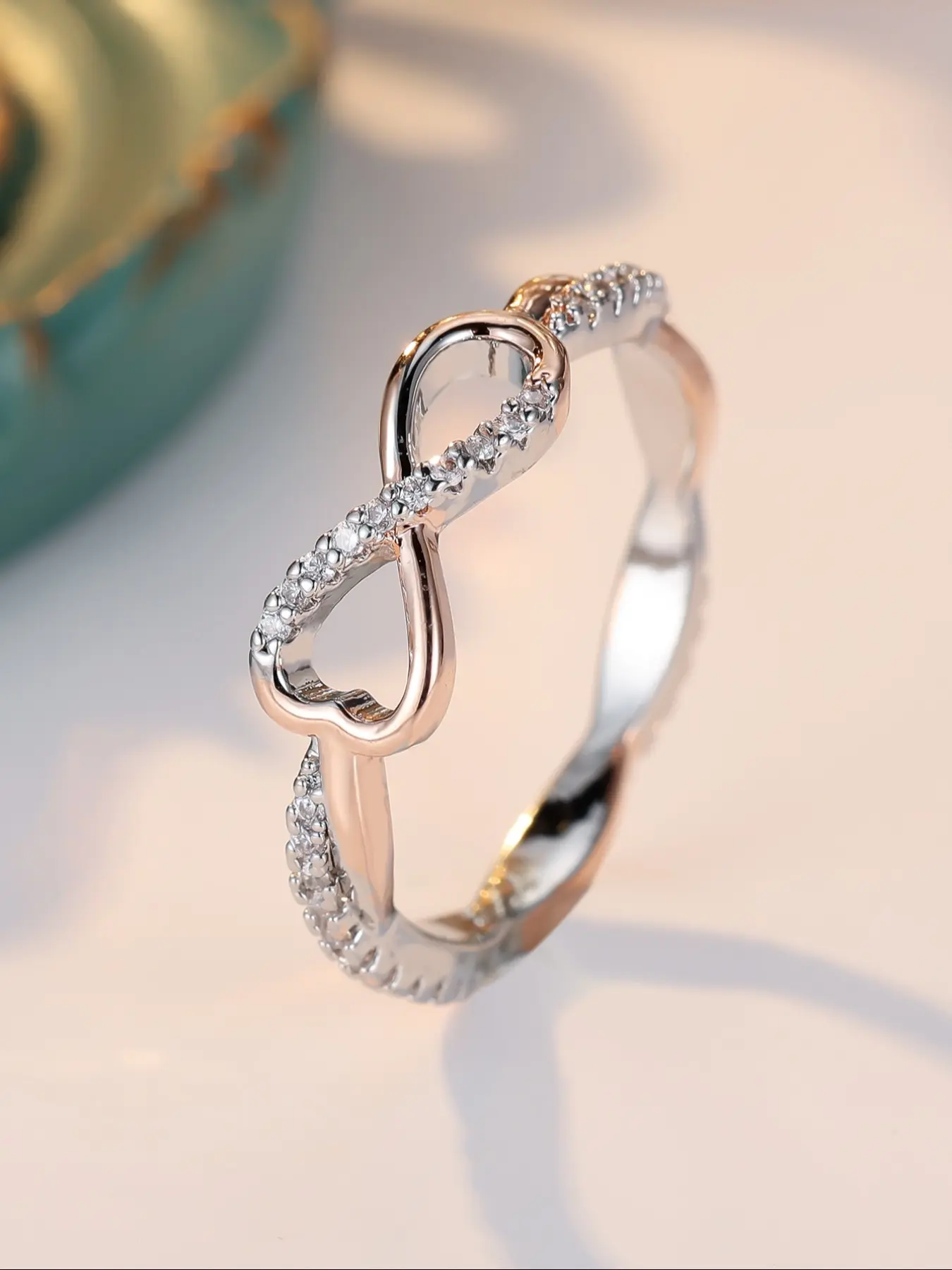 Stylish and glamorous infinity symbol rose gold twist women's ring Acquired Style Ring Fashion Promise Ring Women's fashion party jewellery Zircon Jewelry with white synthetic zirconia embellishments Birthday jewellery gift Statement Rings