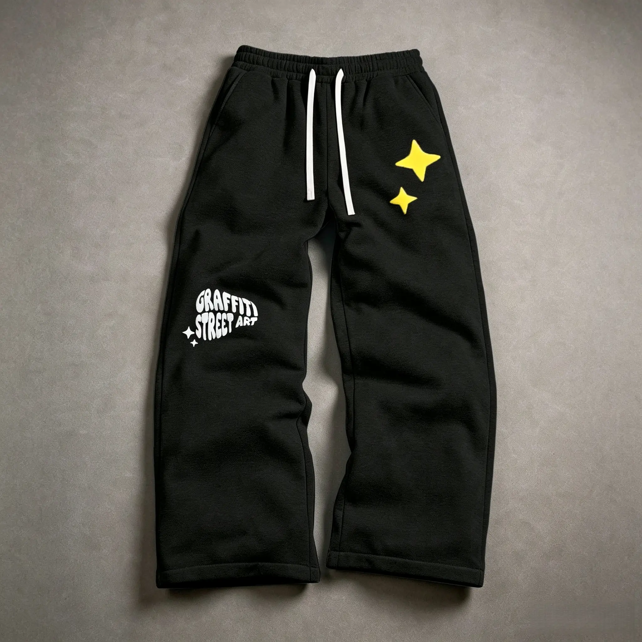 One pair of wide-leg sweatpants with star print, street-style graffiti lettering, and foam printing; loose fit with a drawstring waist; smooth cotton-like fabric with a relaxed drape; perfect for everyday wear, outings, dates, exhibitions, store visits, a