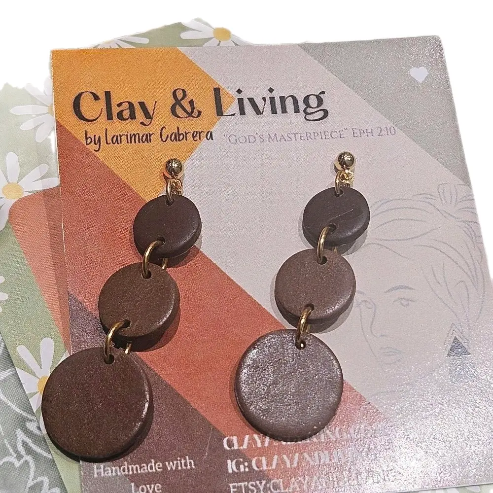 CLAYANDLIVING's Ascending Chocolate Brown Polymer Clay Earrings. She is ALEXANDRIA (Defender of people) Lightweight, Unique, and beautiful. God's Masterpiece by Larimar Cabrera