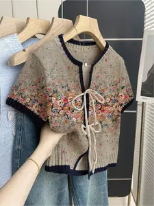Women's khaki bohemian vacation short-sleeve knit top Casual Boho Soft. Loose round neck, contrast floral cluster print, front tie and contrast piping. Comfortable for spring & summer casual wear.