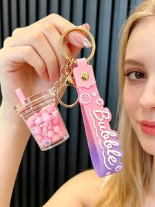 A keychain pendant in the shape of a milk tea cup with flowing oil sand simulation, suitable for daily wear, vacations, dates, and other occasions, and also a delightful and exquisite small gift.