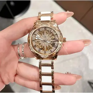 Luxury Skeleton Sunburst Dial Women’s Watch with Crystal Accents Sparkling Diamond-Encrusted Bezel, Roman Numeral Hour Markers, Two-Tone Bracelet with Glossy Inlays, Ornate Sunburst Motif, Glam Statement Timepiece for Special Occasions