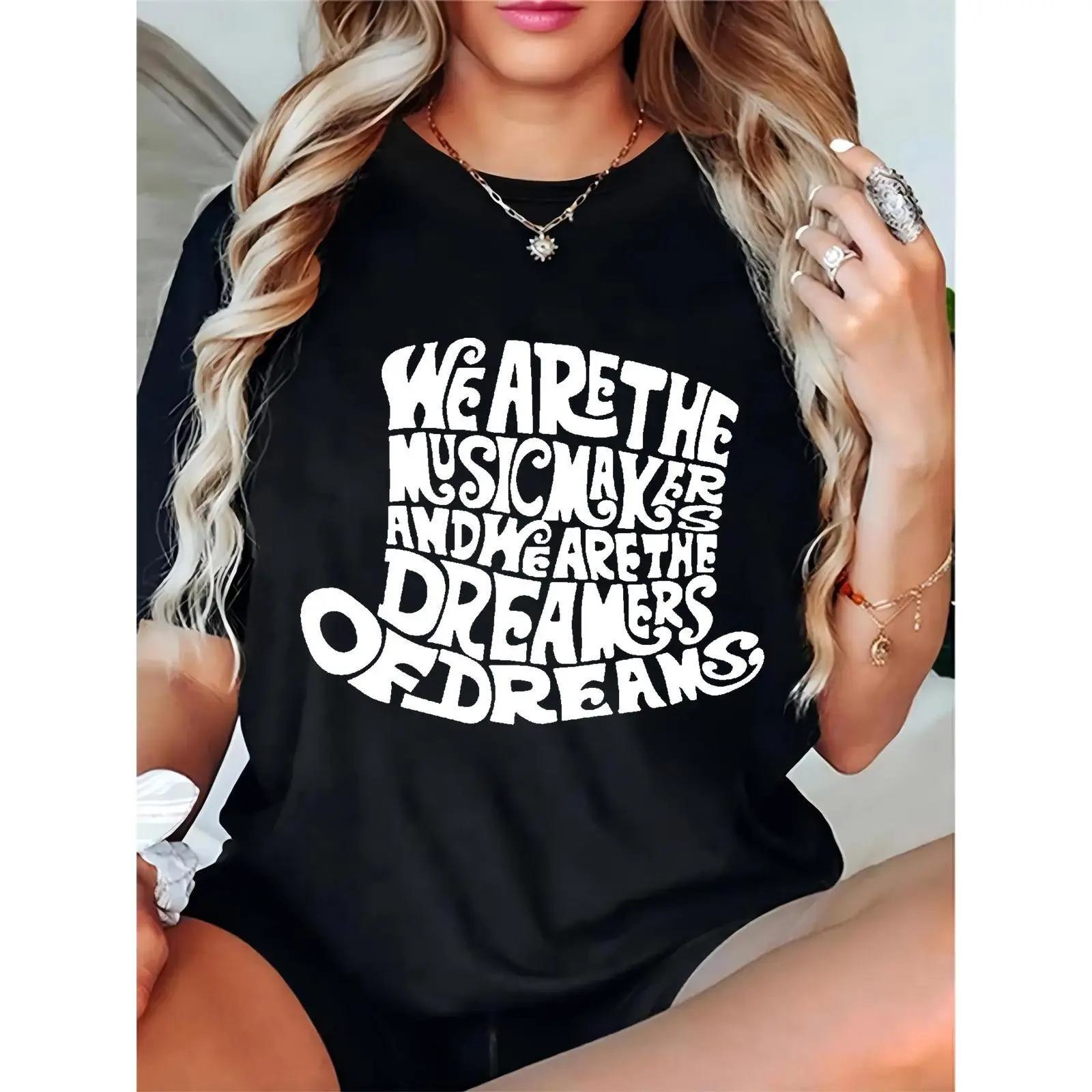 Women's Black T-Shirt with Whimsical Retro "We Are The Musicmakers & Dreamers Of Dreams" Quote Print – Perfect for Music Festivals, Concerts, Casual Daily Wear