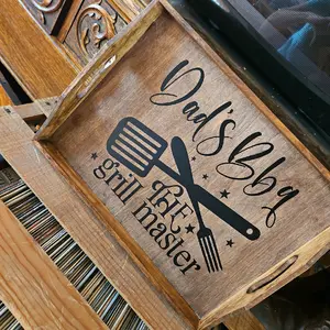 Will be designed on a live!  Custom Grill Trays, Aprons, Signs, and Utensils sold as sets of individual using vinyl, stains and/or wood burning techniques. Stylish Wooden