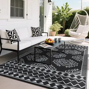 GARVEE Outdoor Patio Rug 8x10 Waterproof Plastic Straw Rug Reversible Camping Mat with 4 Stakes & Portable Bag, Weather Resistant Outdoor Carpet for Deck, Balcony, Lawn, Black+White