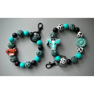 Western turquoise Cow print Wristlet