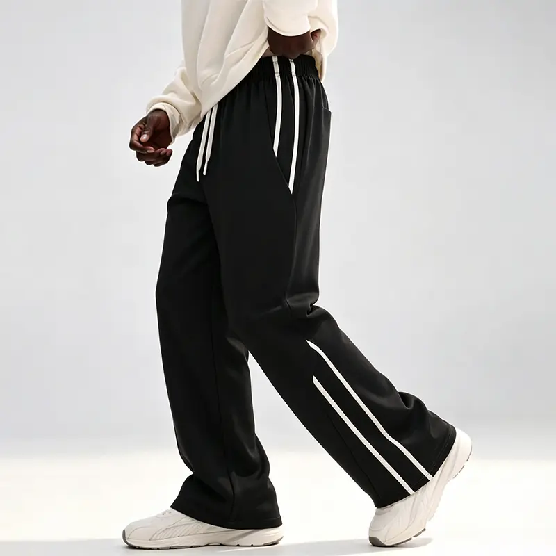 Men’s straight-leg athletic sweatpants with double white stripes along the side; American high-street loose, fluid casual long pants made from a smooth, drapey fabric that resists wrinkling, offering a laid-back, relaxed feel. Classic double white stripe