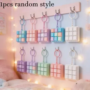 1 mini mechanical keyboard keychain, portable typing accessories, perfect for travel and office use. This keychain (with colored keys and chain) is designed for typing enthusiasts