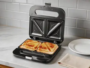 2-slice sandwich and panini maker with a non-stick cooking surface. Ideal for grilled cheese, omelets and more. Features stainless steel construction and steady power for quick daily meals.