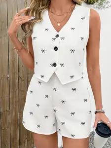 A 2-piece set for women consisting of a sleeveless vest with a white background and black bow print, paired with shorts. It features a sweet-cool, lightly mature style, suitable for relaxed and stylish social occasions such as dates, coffee shop visits, a
