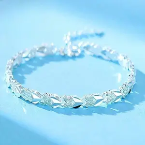 This exquisite silver-plated bracelet features a leaf and flower motif and a polished finish that gleams with a captivating sheen. The adjustable chain fits all wrist sizes, making it a perfect choice for everyday wear or a special party. Elegant, durable