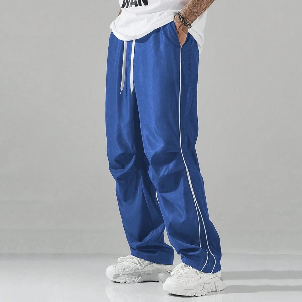 Unisex baggy wide-leg sweatpants; men’s casual athletic pants made from soft fabric with an elastic waistband and drawstring; loose fit with side stripes; breathable, lightweight sports fitness streetwear pants; all-day comfort and versatile for everyday