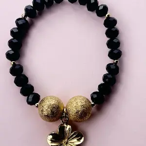 Black Crystal Beaded Bracelet with Gold Balls and flower