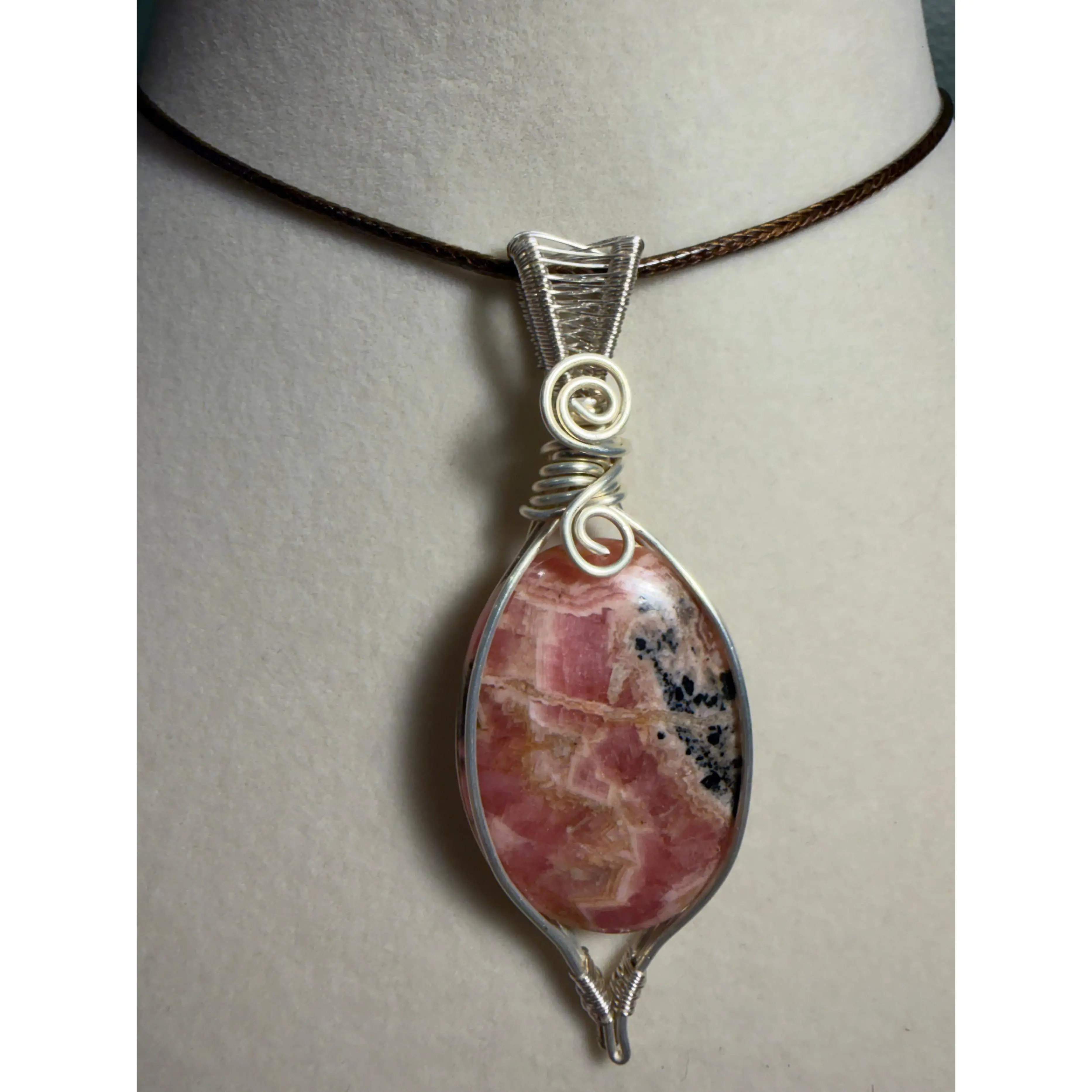 Rhodochrosite silver-tone copper wire-wrapped pendant