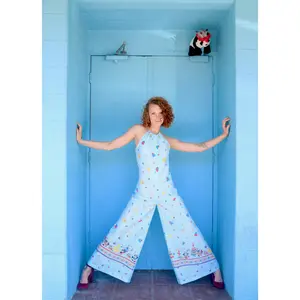 70S INSPIRED LIGHT BLUE SLEEVELESS HALTER TOP JUMPSUIT WITH DANCING NATIVE AMERICAN PANDA BEARS PRINT