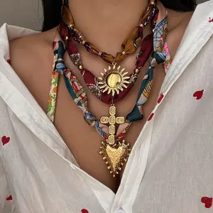 Stainless steel pendant necklace for women featuring a cross, sunflower, and heart design; scarf-style neck chain with a niche, high-end feel—dopamine aesthetic, artistic and fresh floral design.