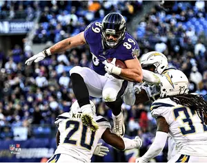 Mark Andrews Baltimore Ravens Unsigned Hurdling Defender Photograph