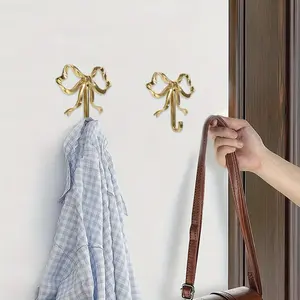 2pcs Golden Metal Bow Wall Hooks - Nordic Retro Polished Finish Decorative Coat Hangers for Bathroom, Bedroom, Entryway - Durable Towel, Hat & Purse Hooks with Easy Wall-Mounted Installation, Bedroom Decor, Vintage Style, Sturdy Construction, Stylish Home