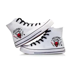 High-top canvas sneakers emblazoned with the Stranger Things Hellfire Club logo, available in black and white, unisex casual shoes.Stranger Things