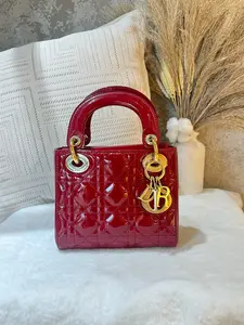Pre-owned Dior Lady Mini Bag in vibrant red cannage quilted patent leather, featuring polished gold tone hardware, iconic CD logo hardware 1919H0871