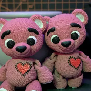 Knitted Bear Fidget with Heart Design in different Colors for Stress Relief and Fun.
