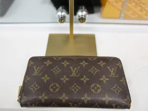 Pre-owned Louis Vuitton CANVAS Clutches & Wristlets MONOGRAM ZIPPY WALLET IN BROWN COATED CANVAS