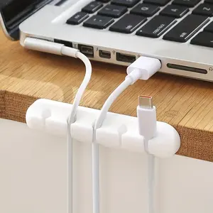A desktop data cable storage and organization device, a charging desktop cable protector for cable storage and organization