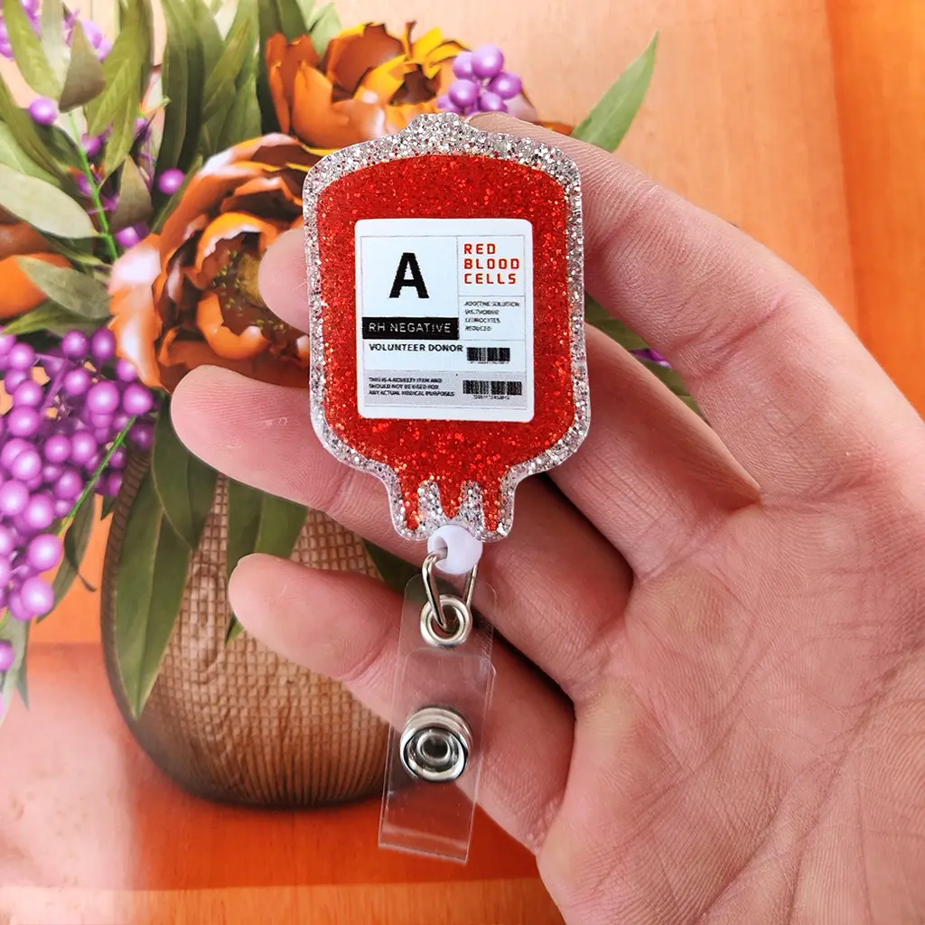 A blood transfusion-themed work card telescopic buckle, main body red glitter blood bag shape, blood transfusion-related text and logos, equipped with telescopic structure and transparent clip, for hanging work cards, Id Badge Holders Retractable