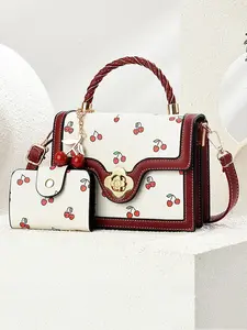 Elegant and versatile cherry-printed mini square handbag for ladies, stylish and cute with complimentary cherry charm, suitable for daily commuting, dating, shopping, and various occasions.
