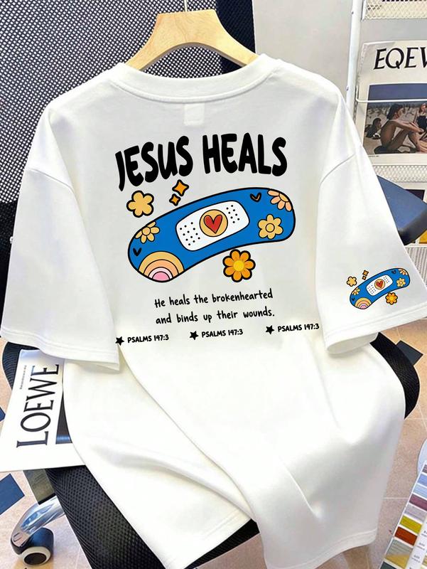 Women's Loose Light Soft Short-Sleeve Round-Neck Oversized Casual Graphic Tee - Groovy Cartoon Band-Aid Design, Heart-Flower Back Print, Mini Band-Aid Sleeve, Psalm 147:3 "He Heals The Brokenhearted" Believer Everyday Shirt