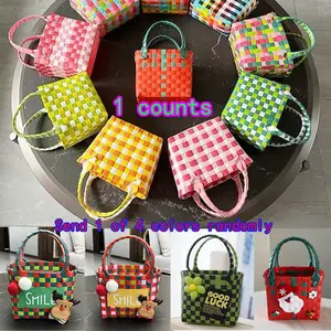 A small plastic handwoven bag (a square vegetable basket, a shopping hand-held small storage basket, a miniature plastic hand-held woven bag, a beach bag, a snack basket, a square bag with dopamine theme