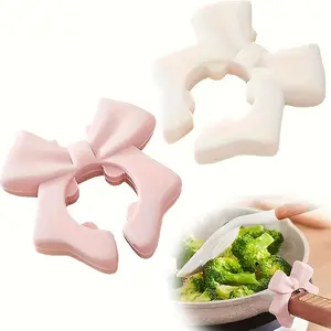 Two anti-slip and heat-resistant silicone spoon and spatula holders, with a semi-arc shape design - a space-saving kitchen storage rack that is suitable for organizing spoons and spatulas on the countertop Tableware