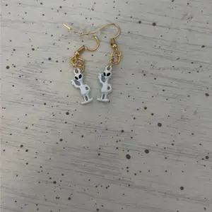 White alien earrings