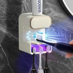 Automatic Toothpaste Dispenser, 1 Count Wall Mounted Toothpaste Squeezer with 3 Toothbrush Slots, Bathroom Supplies for Home Use