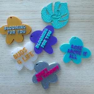 Monstera Leaf Keychain - Assorted Designs with "BLOOMING FOR YOU," "BUDS WITH LIFE," "ROSE ABOVE IT," "DON'T BE TITANIC," and "BLOOMING FOR YOU" Text