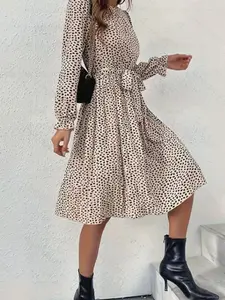 A women's leopard print long sleeved Boho Chic dress with elegant temperament and versatile commuting style