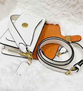 A women's shoulder bag featuring internal compartmentsfor organized storage. It includes a zippered pocket and isaccented with gold-tone hardware-an ideal accessory forboth commuting and travel, making it a stylish gift for her.