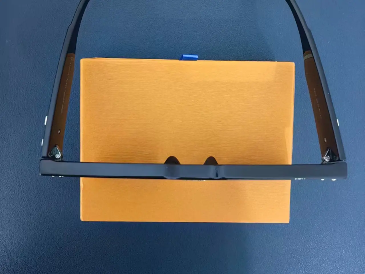 Modern Black Sunglasses with Brown Lenses and Unique Design in Orange Box