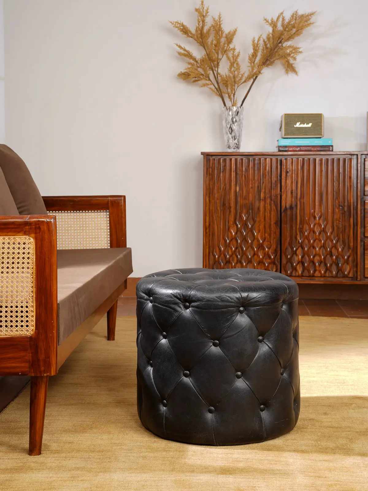 The Regal Repose – Round Tufted Leather Ottoman with Solid Wood Frame