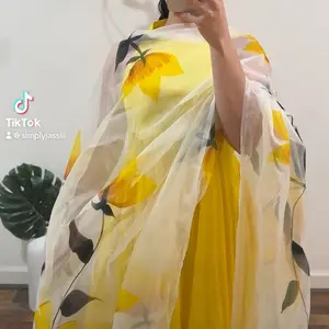 Sunflower Anarkali — Size 38 A beautiful, floaty Sharara-style set featuring an Anarkali halter top paired with stunning organza sharara pants. This dreamy outfit is covered in hand-printed flowers that bring a soft, radiant glow — perfect for festive