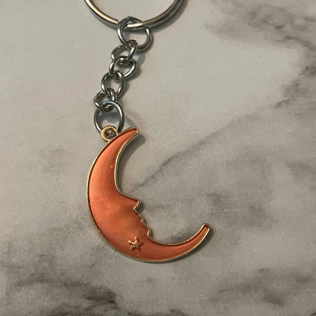 Blessing to the Moon Key Chain - Orange Crescent Moon Design with Star Charm and Chain Attachment